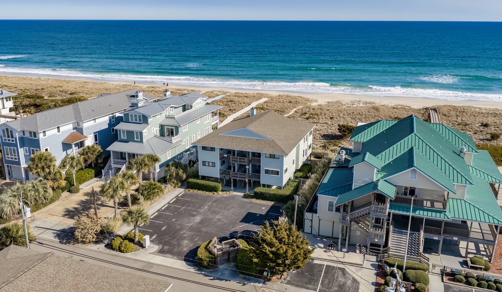 Beachfront vacation rental community featuring oceanfront properties with direct beach access and stunning coastal views.
