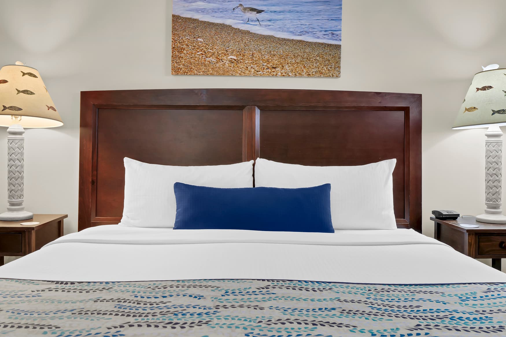 Drift off to restful sleep surrounded by coastal charm and crisp linens in your tranquil retreat.