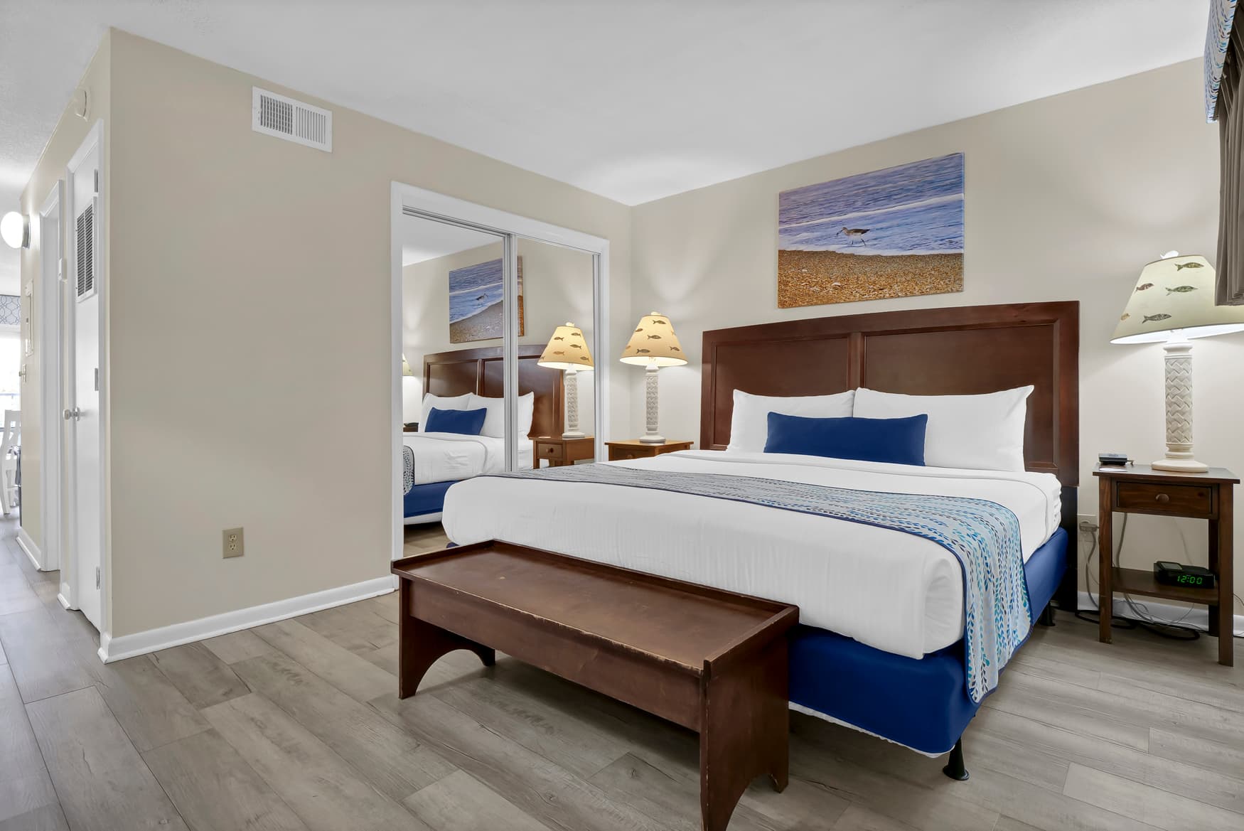 Unwind in your elegant suite with coastal artwork and plush linens that invite restful nights.