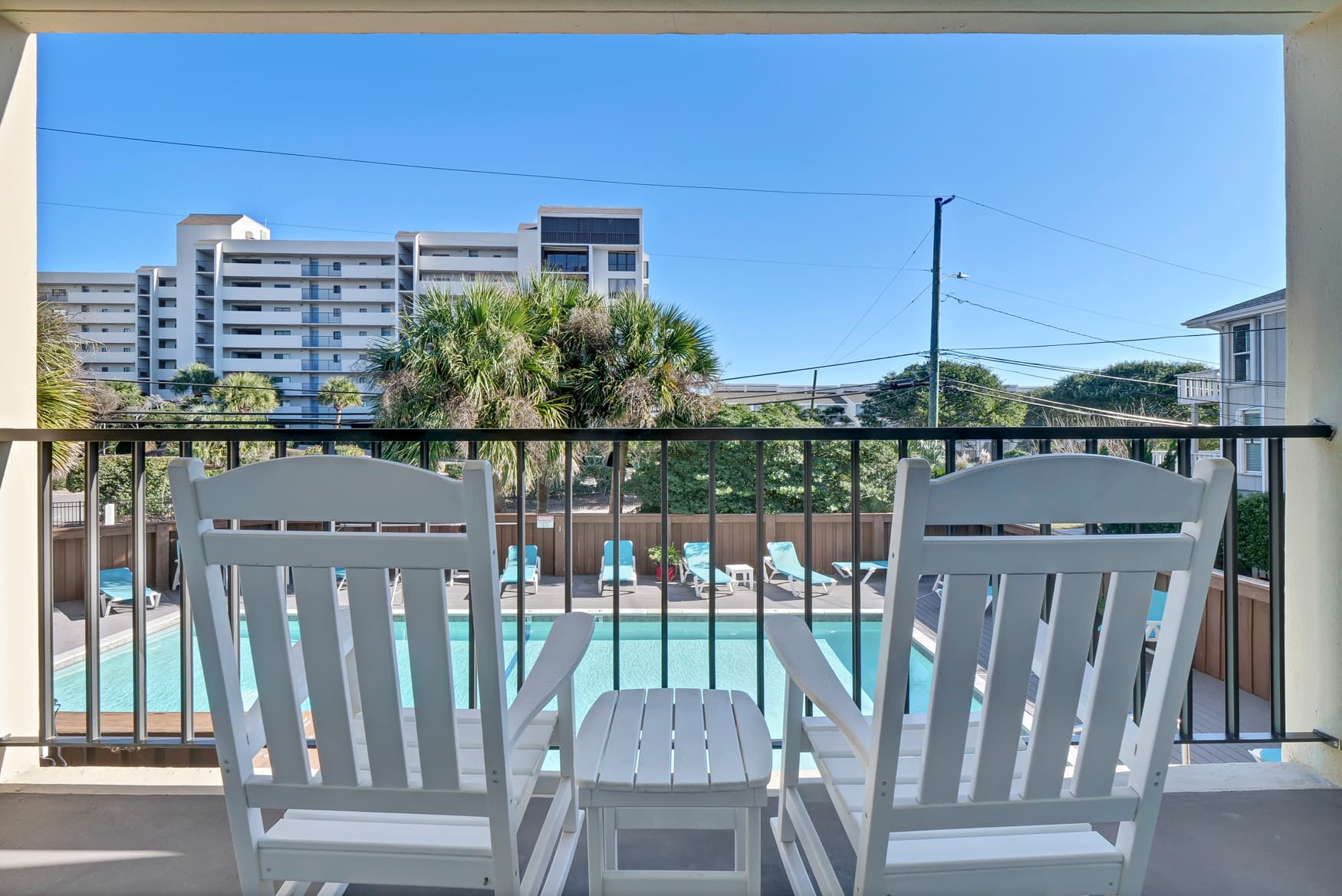 Relax on your private balcony with pool views, where morning coffee tastes better with coastal breezes and tropical scenery.