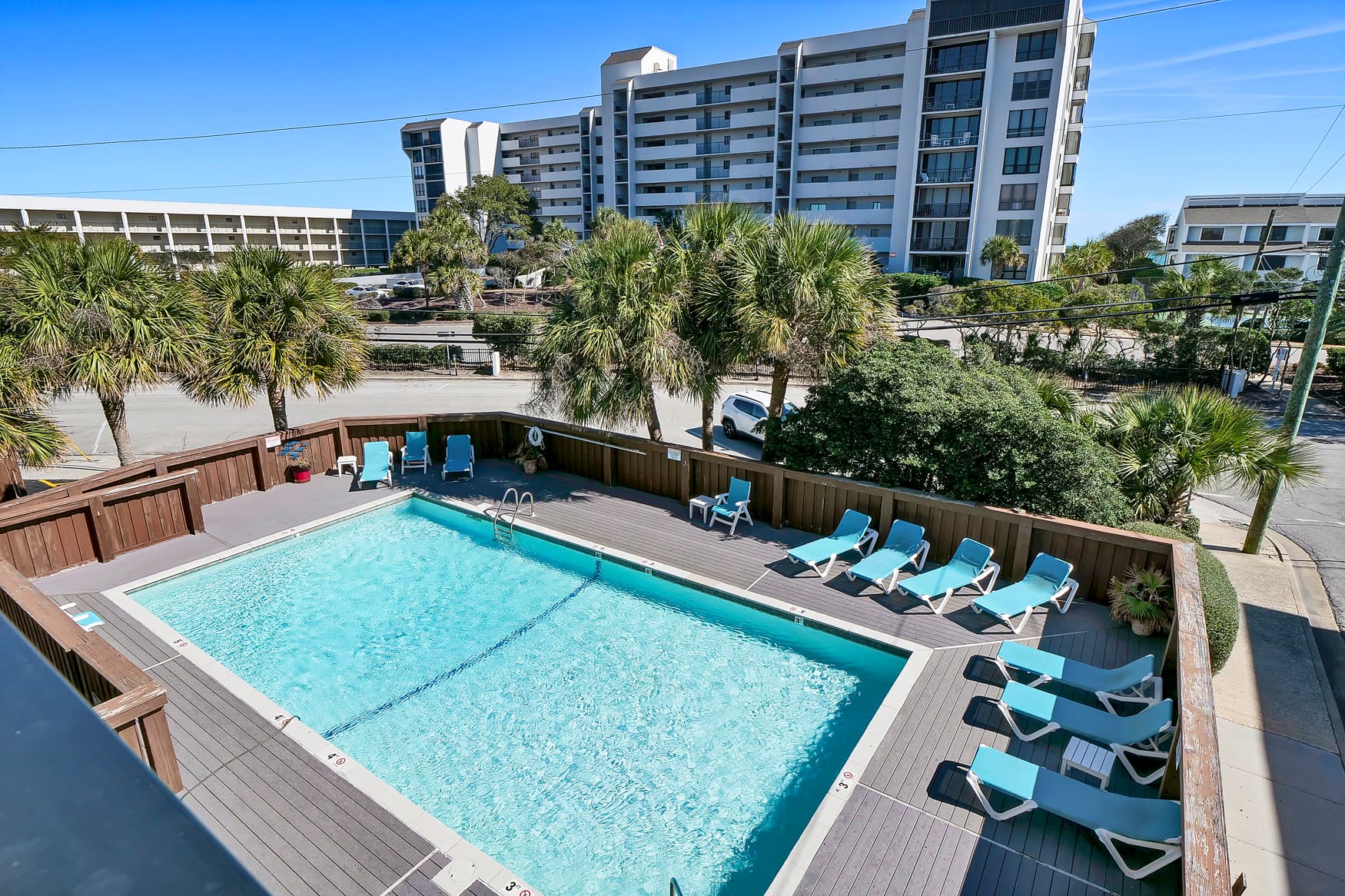 Sparkling resort saltwater pool close to the ocean and local tourist attractions.