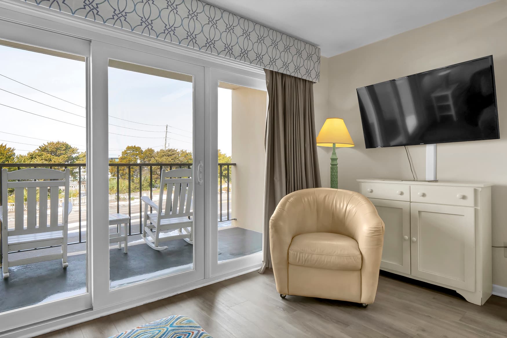 Relax in your comfortable armchair while enjoying the view from your private balcony.