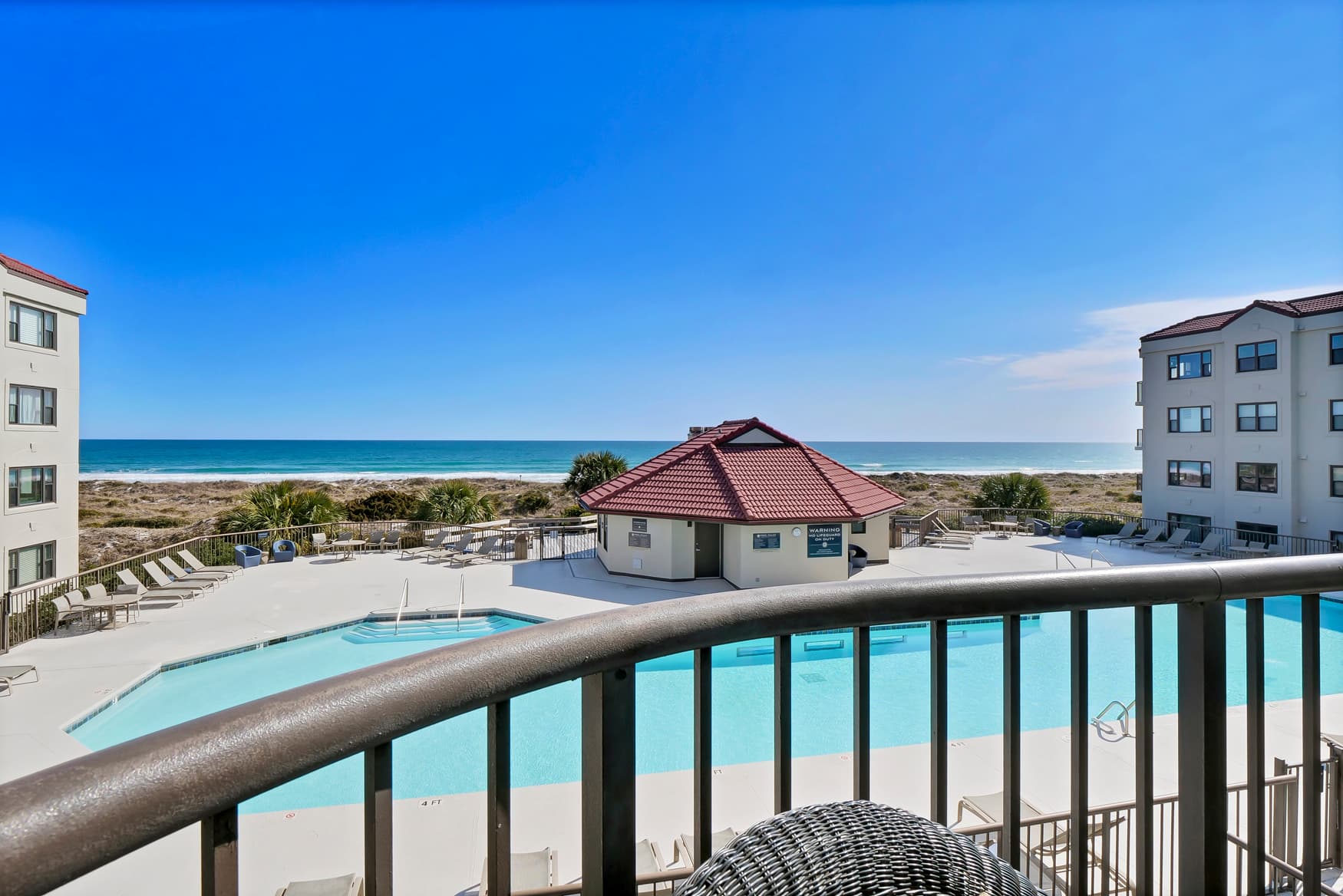 Pool and ocean views from balcony.