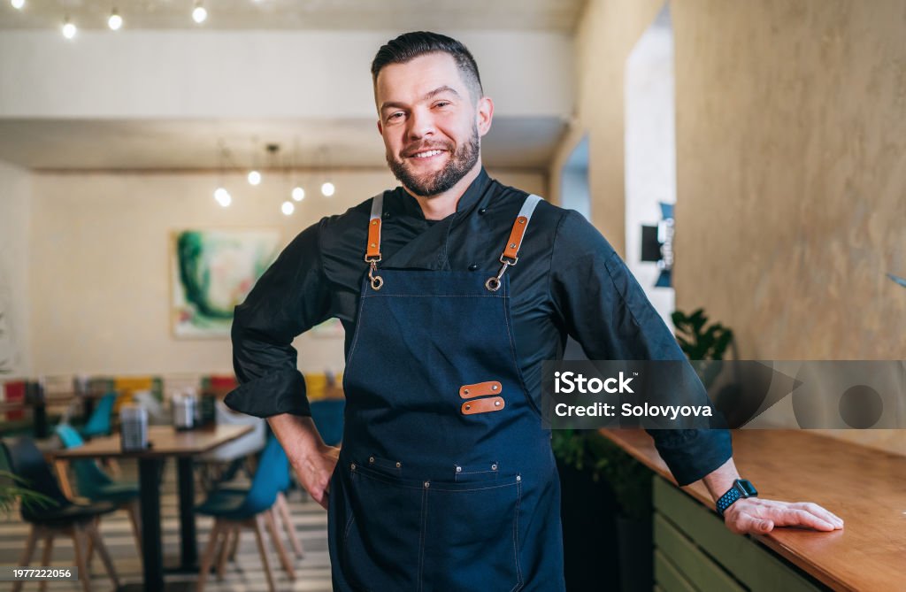 Local restaurant owner welcoming guests