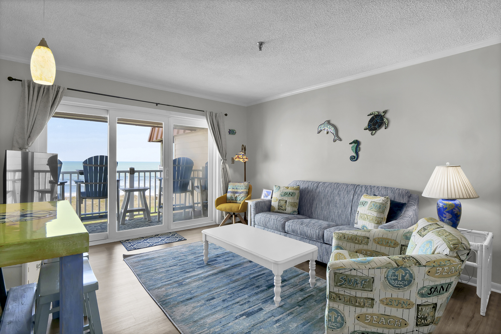 Beach-themed living room with ocean view