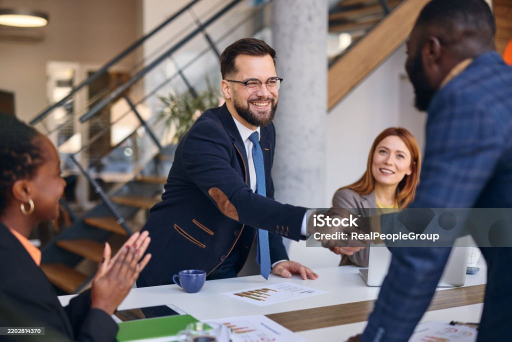 Property managers shaking hands during a meeting