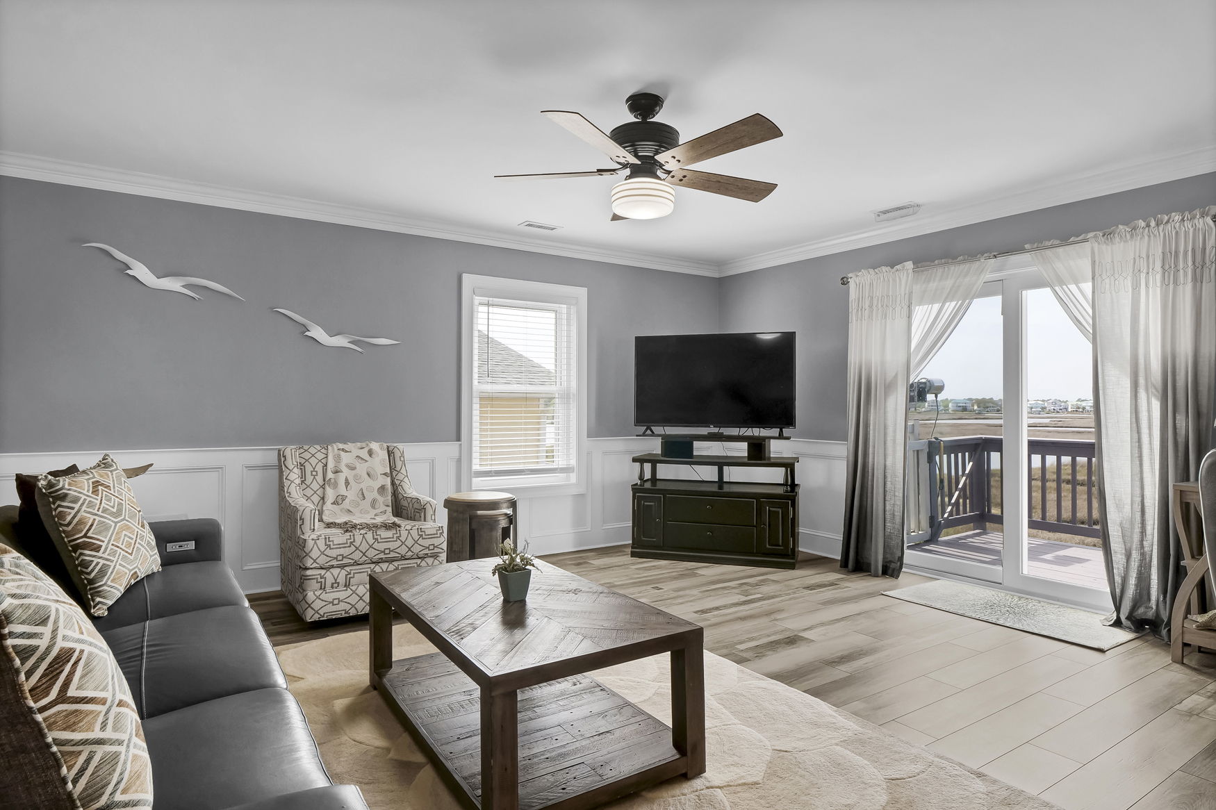 Bright coastal living room and kitchen of a vacation rental