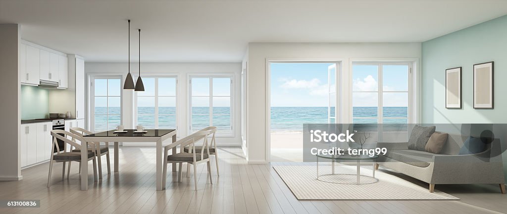 Furnished coastal apartment with a dining table and ocean view