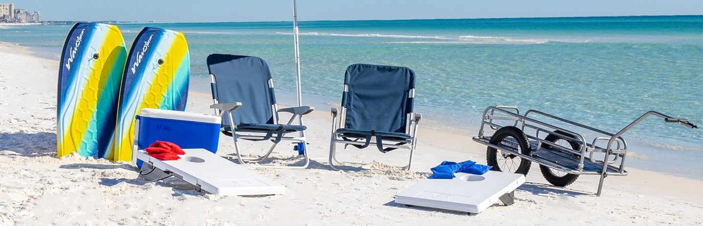 Beach chairs and umbrella set up on the sand facing the ocean