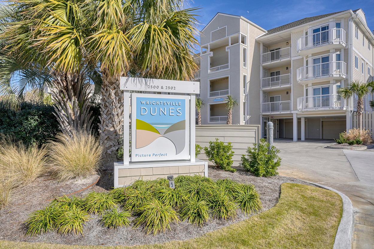 Wrightsville Dunes condominium exterior with palms