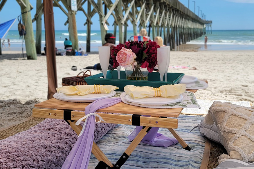 Styled beach picnic set up near the pier